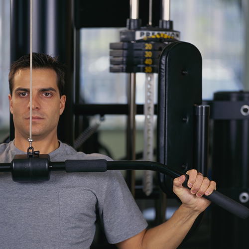 Man Lifting Weights --- Image by © Royalty-Free/Corbis